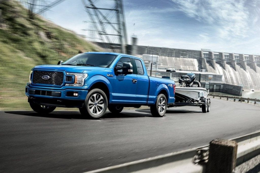 Blue Ford F-150 Pulling a boat