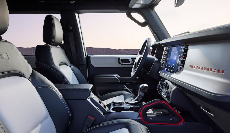 The 2026 Ford Bronco is a four-door SUV with removable roof panels and doors, also showcasing rugged body-on-frame design.